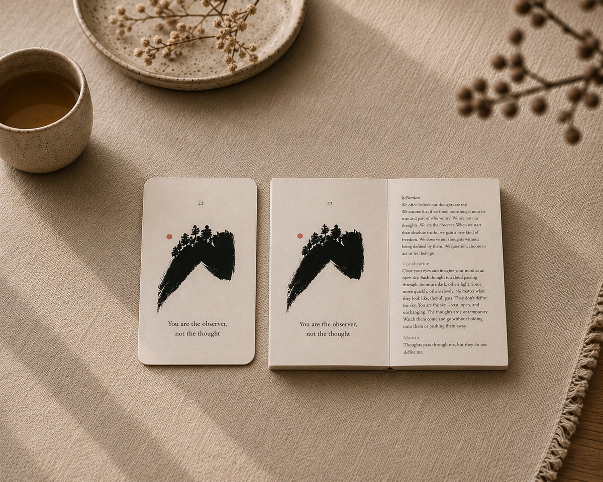 The Kokū You are the observer, not the thought card beside the open Pocket Book on beige fabric, each showing a hand-painted ink brushstroke and vermilion dot, styled with a cup of tea and dried flowers.